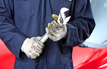 Mechanic holding wrench